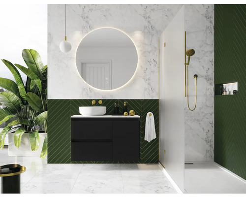 Baie modernă cu dulap negru sub lavoar, oglindă rotundă cu iluminare și duș.