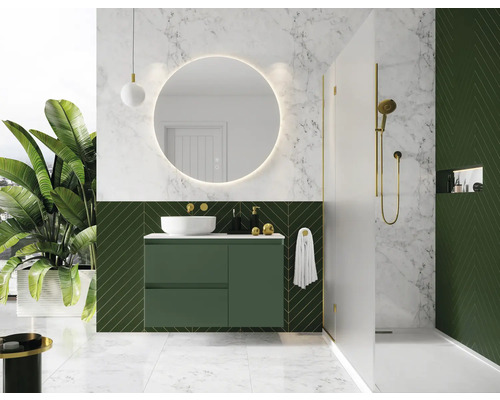 Baie modernă cu dulap verde sub lavoar, oglindă rotundă și duș