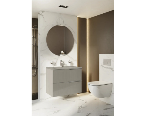 Baie modernă cu dulap de bază pentru lavoar, oglindă rotundă și WC suspendat.