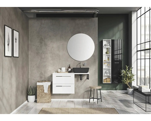 Baie modernă cu lavoar, oglindă rotundă și mobilier alb.