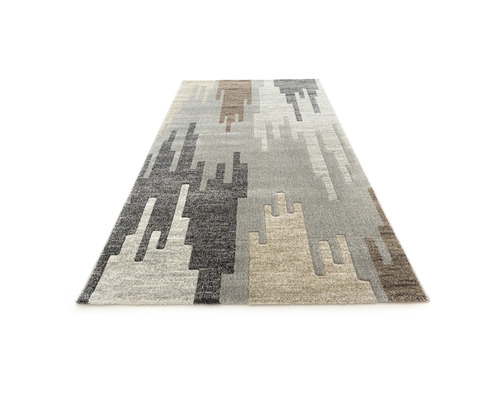 Covor cu model abstract în diferite nuanțe de gri și maro