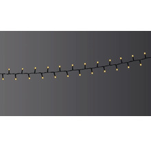 Șir luminos cu LED-uri alb cald pe cablu negru