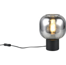 Lampă de masă decorativă cu abajur din sticlă transparentă și întrerupător pe cablu.