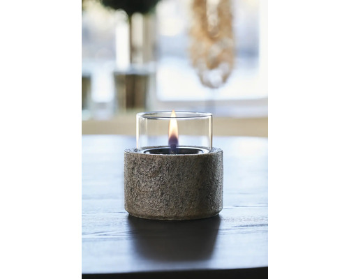 Lampă decorativă cu ulei cu atașament de sticlă și bază de piatră pe masă