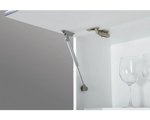 Arc de mobilier și balama de mobilier într-un dulap alb