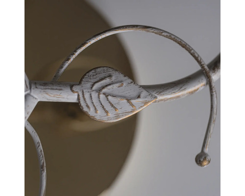 Imagine detaliată a unei lămpi de tavan albe cu ornament de frunze