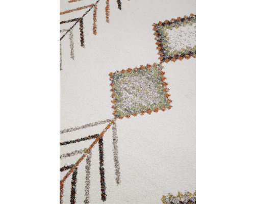 Detaliu al unui covor cu modele geometrice