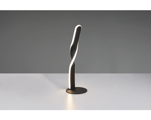 Lampă de masă cu LED cu design spiralat pe o masă