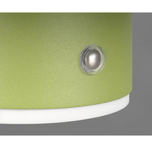 Prim-plan al unui produs verde cu un buton rotund transparent