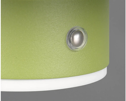 Prim-plan al unui produs verde cu un buton rotund transparent