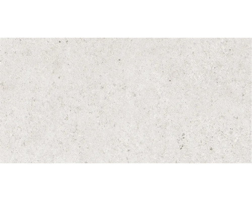 Prim-plan cu o placă de podea deschisă la culoare, cu un model pestriț