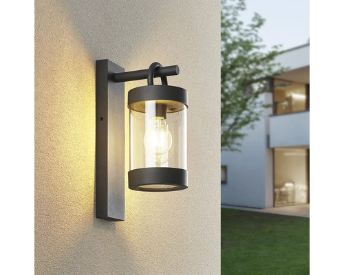 Aplică exterior în jos Sambesi E27 max. 1x28W, senzor crepuscular, IP44, antracit Lumină de perete pentru exterior cu un difuzor cilindric din sticlă transparentă și un bec.