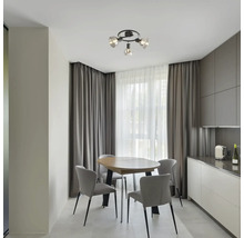 Zonă de luat masa cu masă, scaune și plafonieră cu design modern