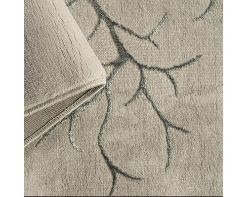 Prim-plan al unui covor bej cu un model de ramuri