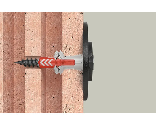 Fixare cu diblu și șurub într-un perete de cărămidă