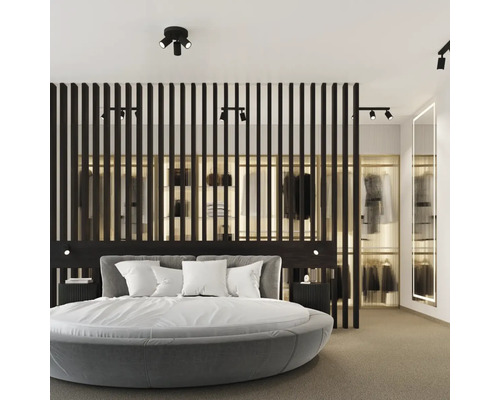 Dormitor cu pat rotund, lambriu din lemn și dressing