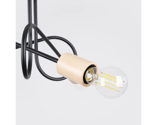 Imagine detaliată cu o lampă suspendată cu bec și elemente din lemn și metal