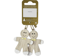 Doi oameni de turtă dulce din lemn cu fundă ca decorație