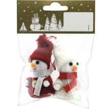 Două figurine de om de zăpadă ca decorațiuni pentru pomul de Crăciun într-un ambalaj.