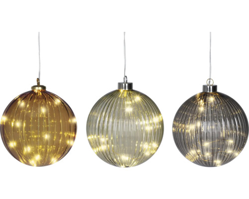 Trei globuri decorative de Crăciun cu iluminare cu LED.