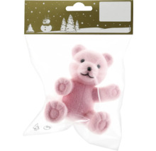 Ursuleț de pluș roz ca articol decorativ într-un ambalaj de plastic