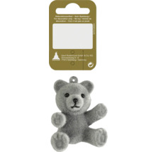 Ursuleț de pluș ca articol decorativ cu etichetă