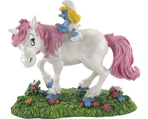Ștrumpfița călărește o figurină de unicorn pe gazon
