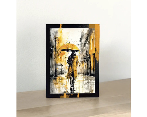 Imagine decorativă cu un bărbat cu umbrelă în ploaie într-un cadru negru