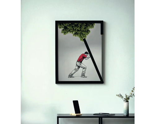 Imagine înrămată cu un bărbat care sprijină un copac