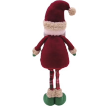 Vedere din spate a unei figurine decorative Moș Crăciun cu haină roșie, pantaloni în carouri și căciulă