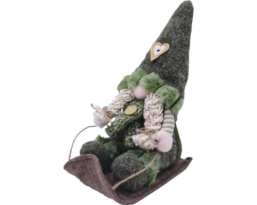 Figurină decorativă ca un spiriduș pe sanie cu aplicație inimă pe pălărie