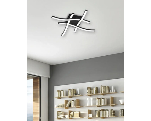 Plafonieră modernă cu benzi LED curbate în sufragerie.