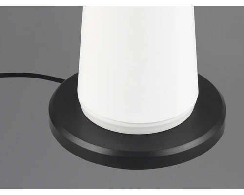 Prim-plan al unei lămpi de masă cu bază rotundă