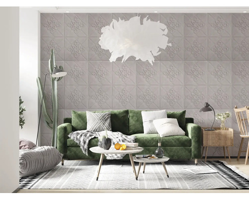 Living cu canapea verde, perete cu model și iluminat decorativ