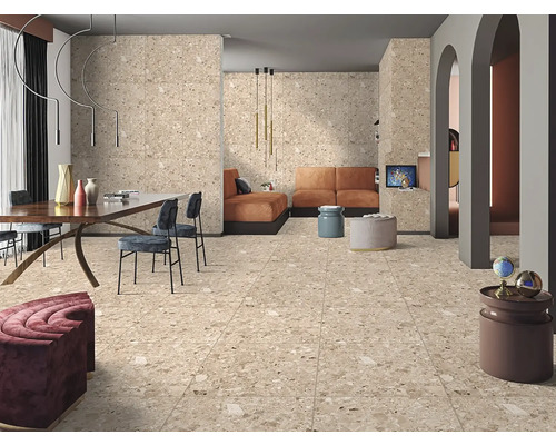 Cameră de zi luminoasă cu gresie și faianță în stil terrazzo, zonă de luat masa și zonă de relaxare.