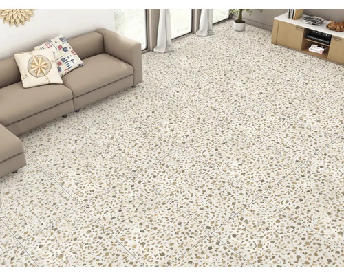 Cameră luminoasă cu pardoseală din gresie terrazzo, canapea și comodă