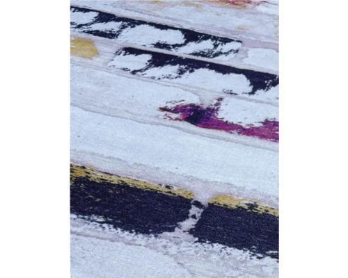 Detaliu al unui covor cu model abstract