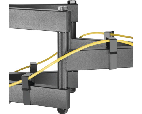 Imagine detaliată cu un suport de perete pentru televizor gri cu rutare cabluri