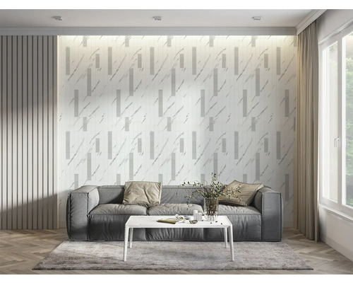 Living cu canapea gri, măsuță de cafea albă și panouri de perete