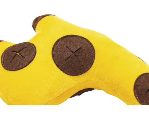 Prim-plan cu un cap de girafă galben de pluș cu pete maro