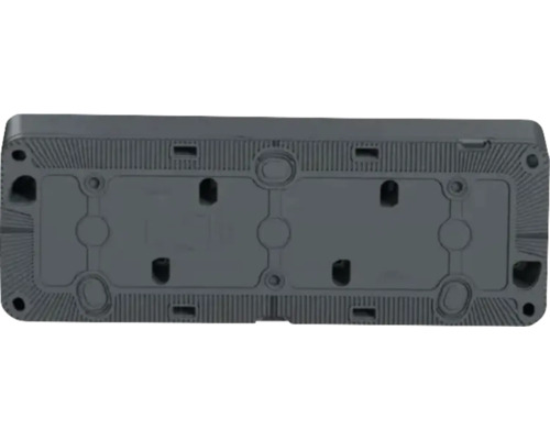 Partea inferioară a unui dispozitiv electronic cu decupaje și puncte de fixare.