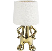 Lampă de masă decorativă cu abajur alb și picior auriu în formă de figurină.