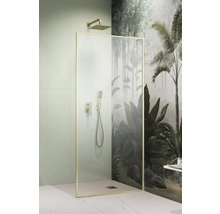 Cabină de duș cu duș fix și duș de mână în fața unui perete cu motiv de junglă.