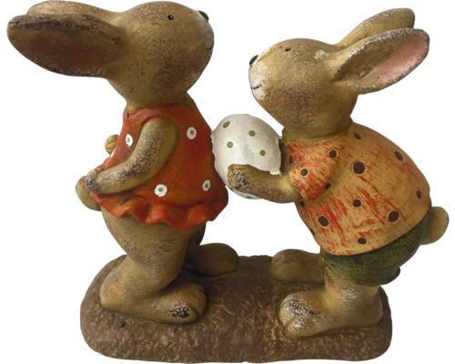 Figurine decorative de iepurași pe un piedestal, o figurină ține un ou