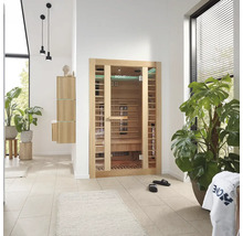 Cameră luminoasă cu saună Home Deluxe, plante și mobilier de baie.