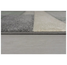 Imagine detaliată a unui covor cu model geometric