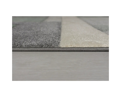 Imagine detaliată a unui covor cu model geometric