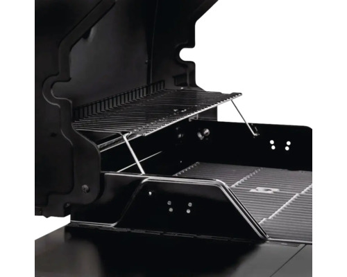 Imagine din interior a unui grătar pe gaz negru cu grătar