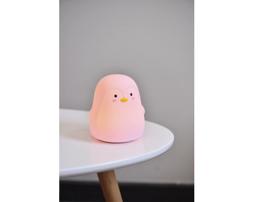 Lumină de noapte roz pinguin pe o masă