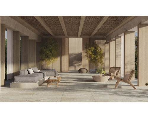 Terasa luminoasă cu mobilier de lounge, plante și plăci de mari dimensiuni